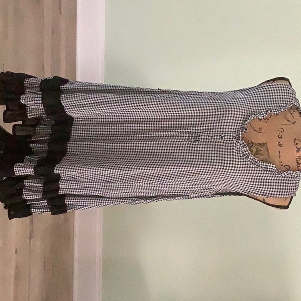 Dress, black and white checkered with black ruffle on bottom. Size large